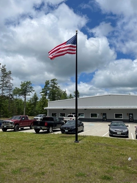 Flagpole next to a business
